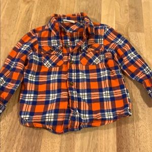 4/10$$ Plaid flannel button down shirt.